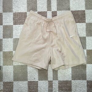 Nike Women's Beige Athletic Shorts with White Swoosh